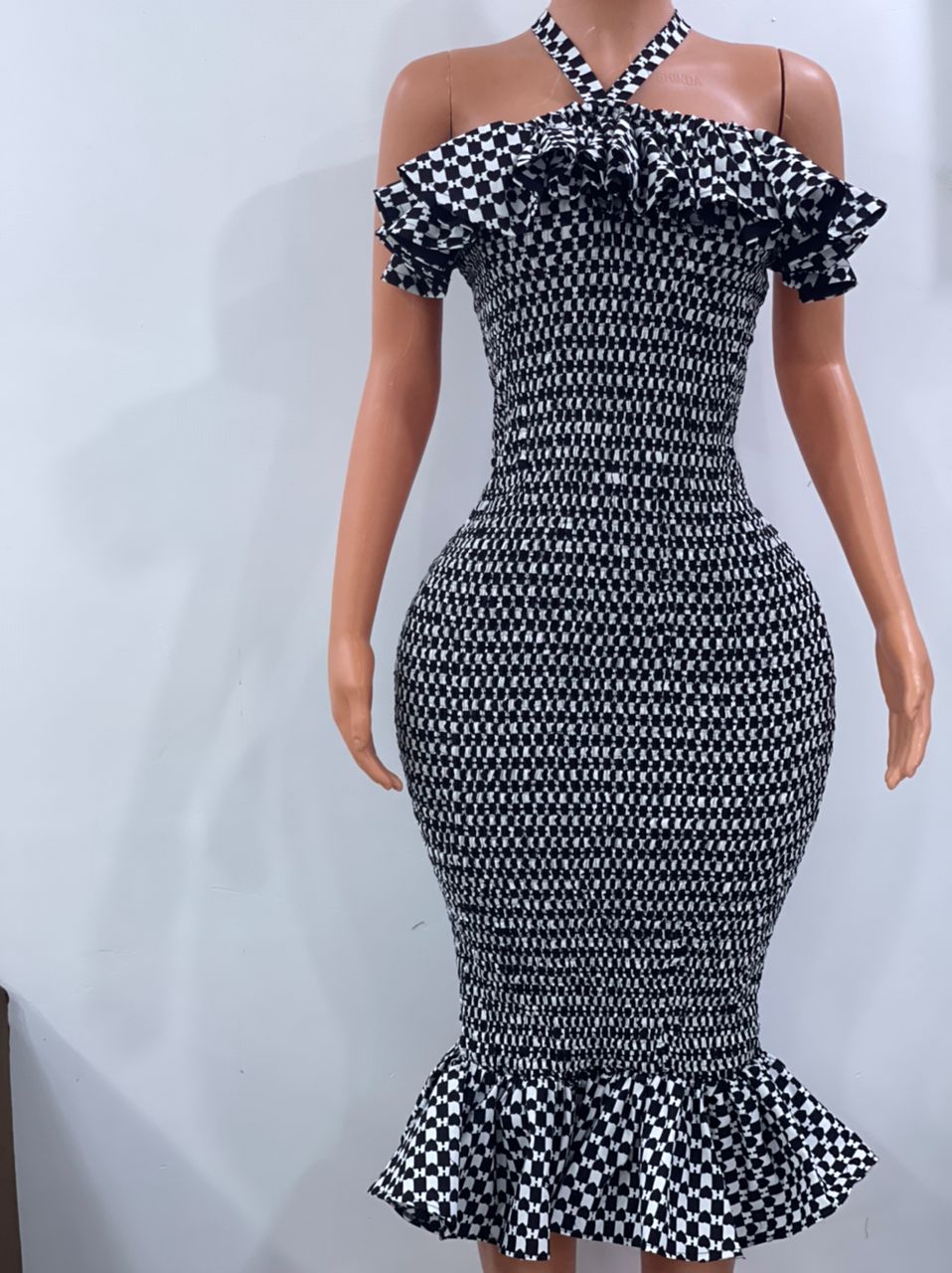 Criss cross neckline smoked dress in black and white ankara