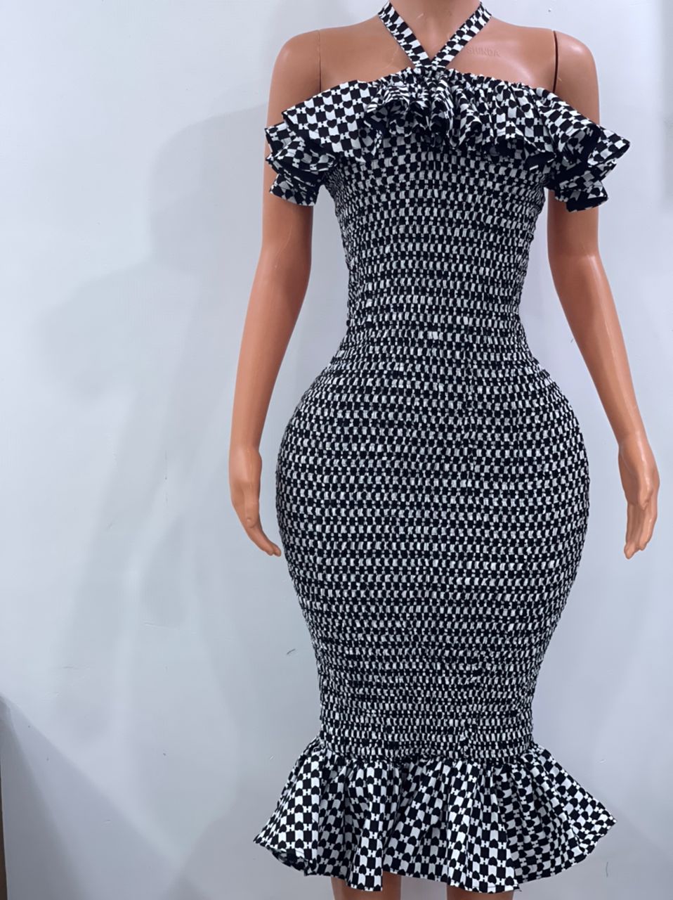 Criss cross neckline smoked dress in black and white ankara